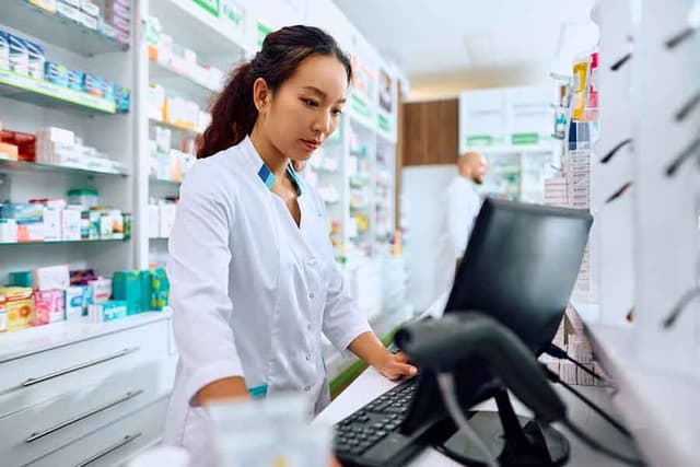 Pharmacist working at computer